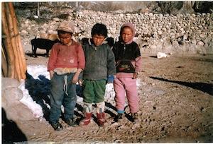 Daniel (bottom picture, left) as a young boy in his village