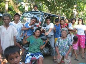 Ps Ricardo (driving the pedicab) & church members